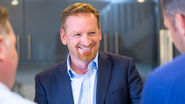 Man in interview meeting, smiling